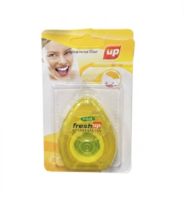 Зубна нитка fresh up у жовтій упаковці з м'ятним ароматом, 50 штук.