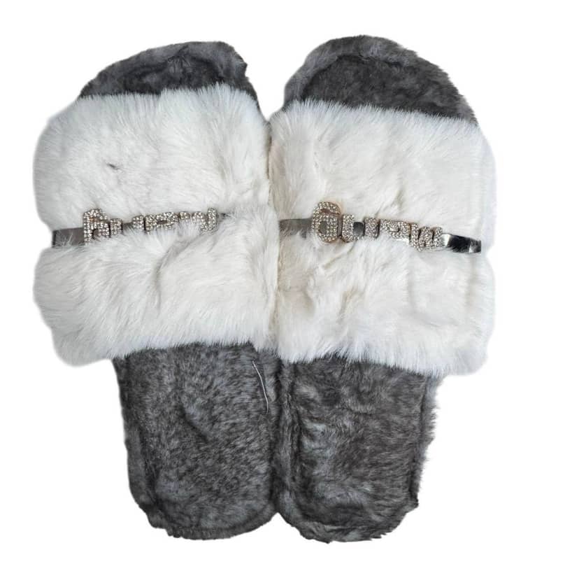 A pair of women's home slippers in white color with gray inserts on the upper part and a decorative