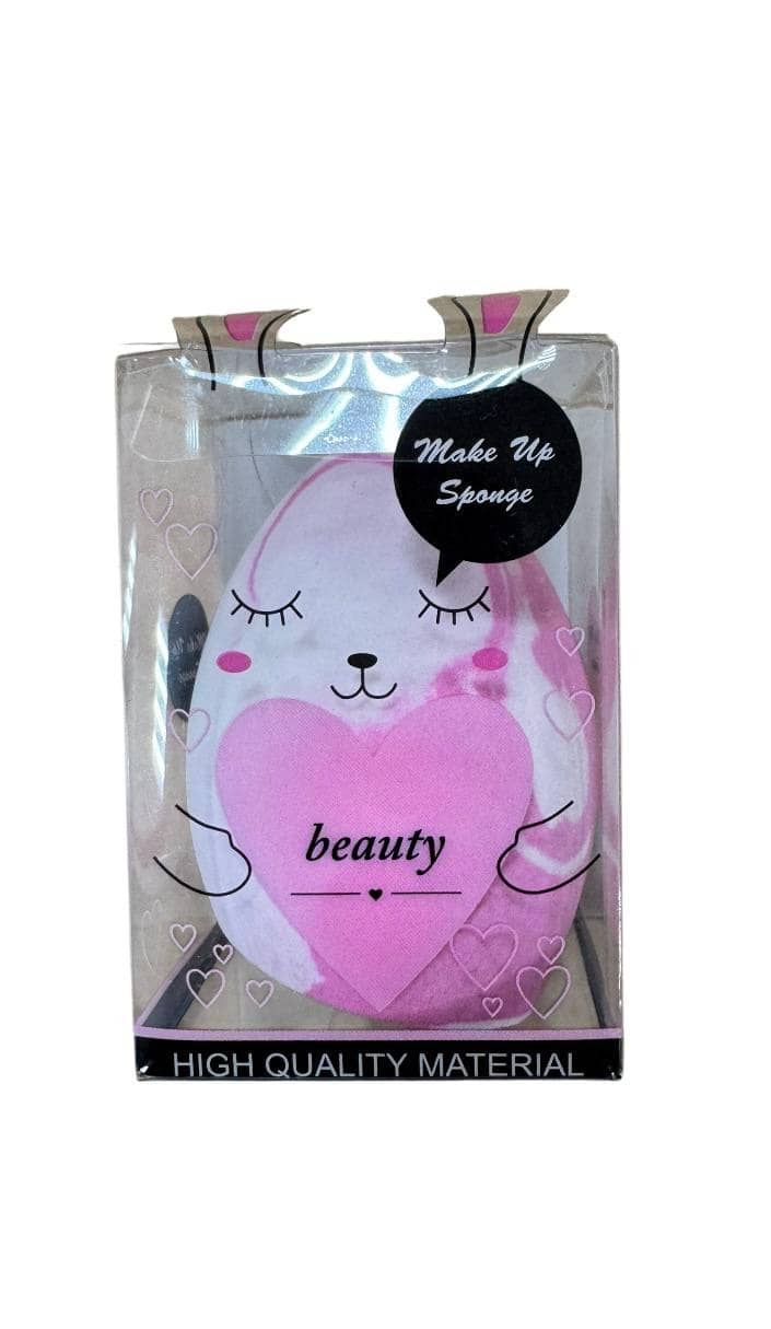 Makeup sponge in the shape of a pink bunny with closed eyes and smile, large pink heart on chest