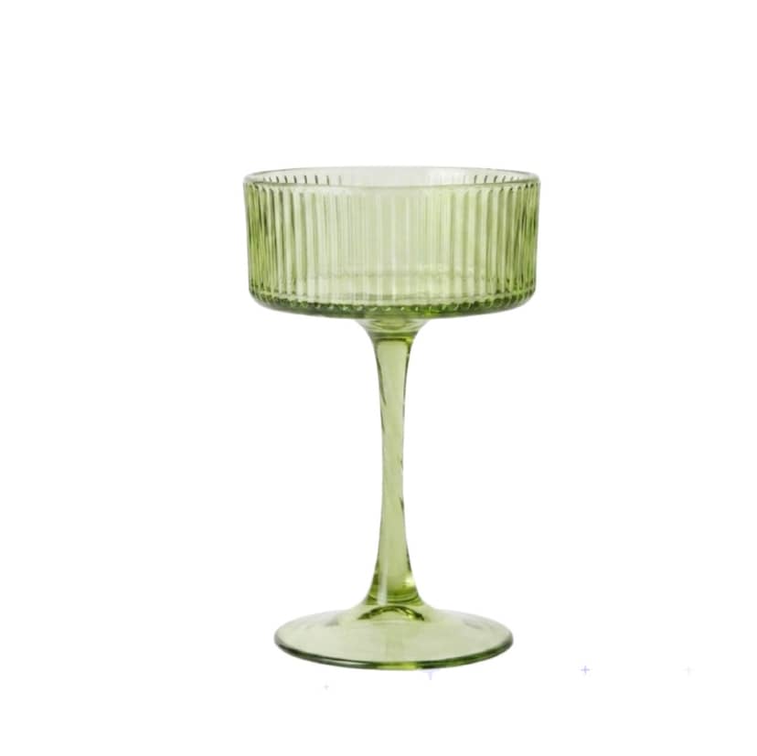 Green cocktail glass with ribbed design on a tall stem