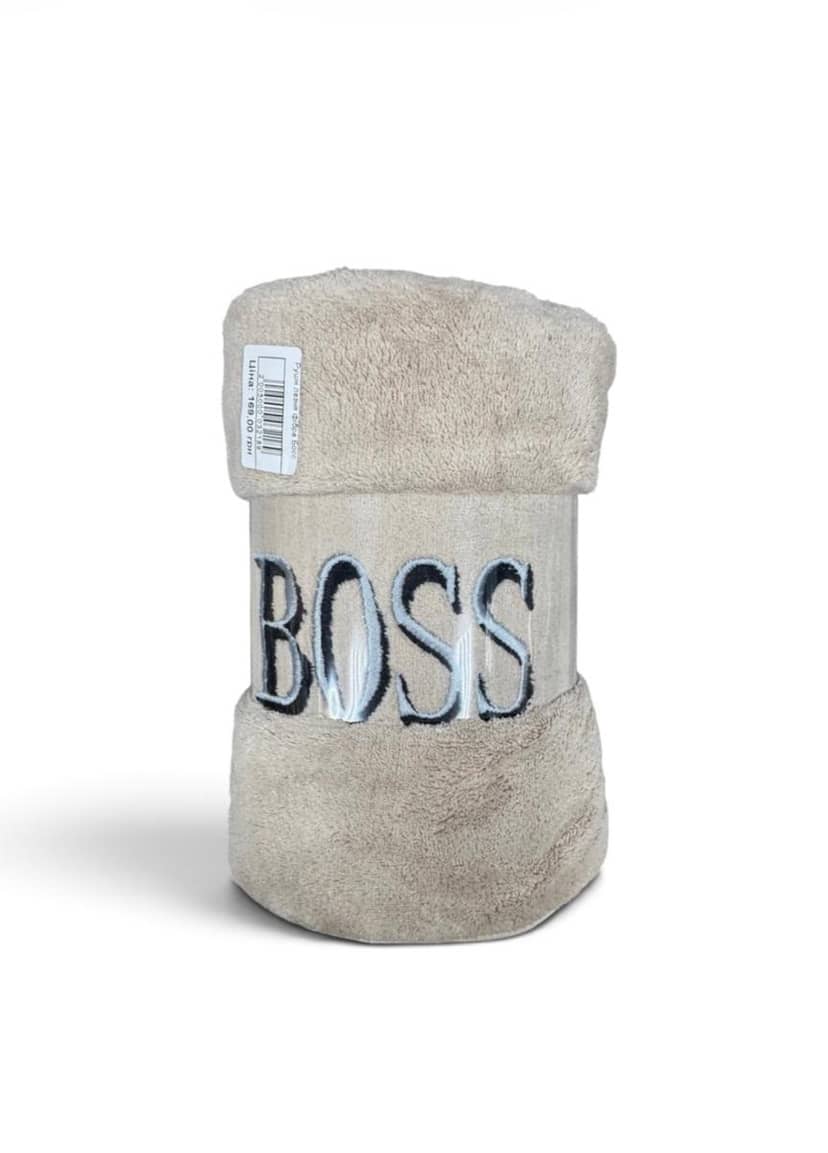 Beige fiber Boss towel rolled for spa use